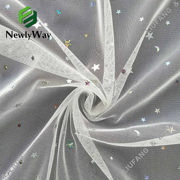 Bright sequin tulle fabric of stars and moons for the fairy skirt