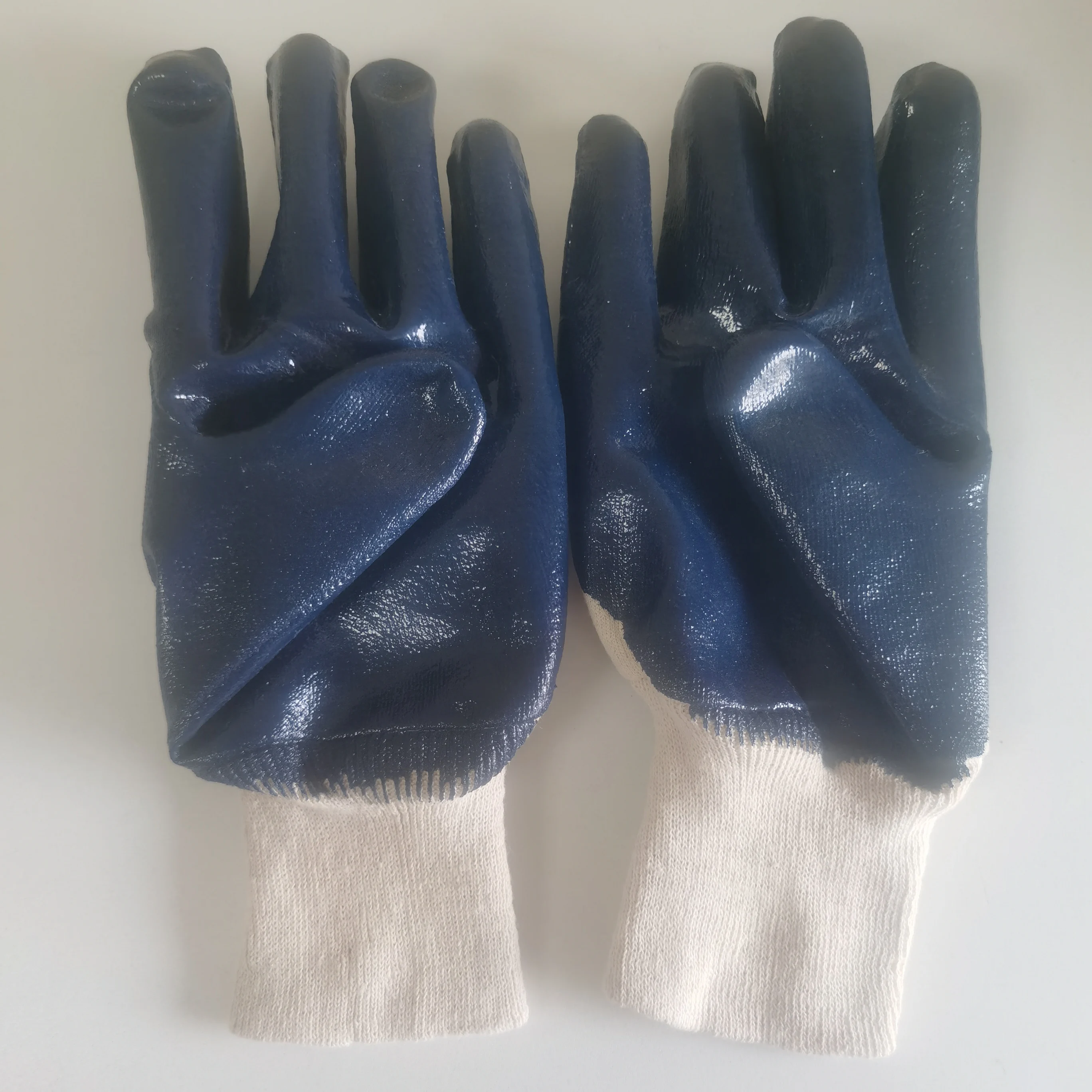 
bule nitrile coated with jersey liner smooth finish with knit wrist gloves 