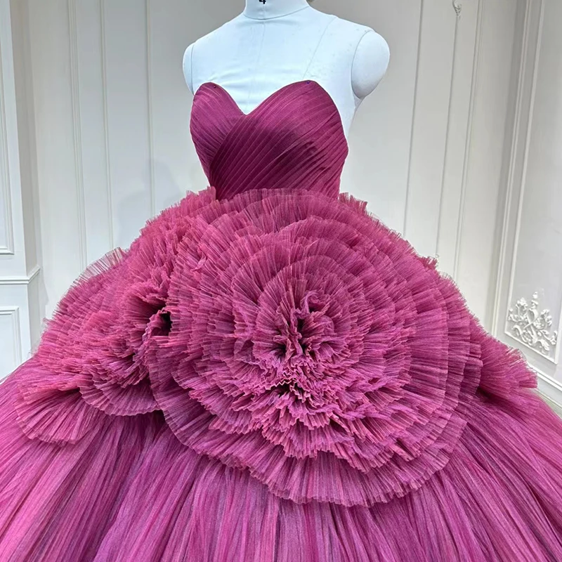 traditional ball dress made of pleated mesh and a large skirt with a bra on the evening dress