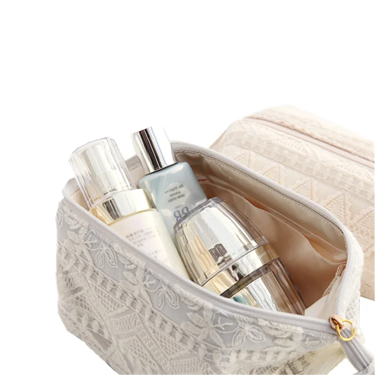 Wholesale China suppliers custom design satin lace bag packaging silk luxury packing bag with tassels and zipper for makeup