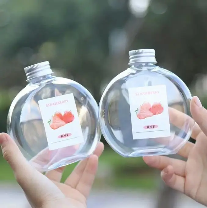 Customized High-quality 500ml 16 oz Flat Round Empty Oval PET plastic Beverage Juice Bottle for juice packing with Aluminum lid