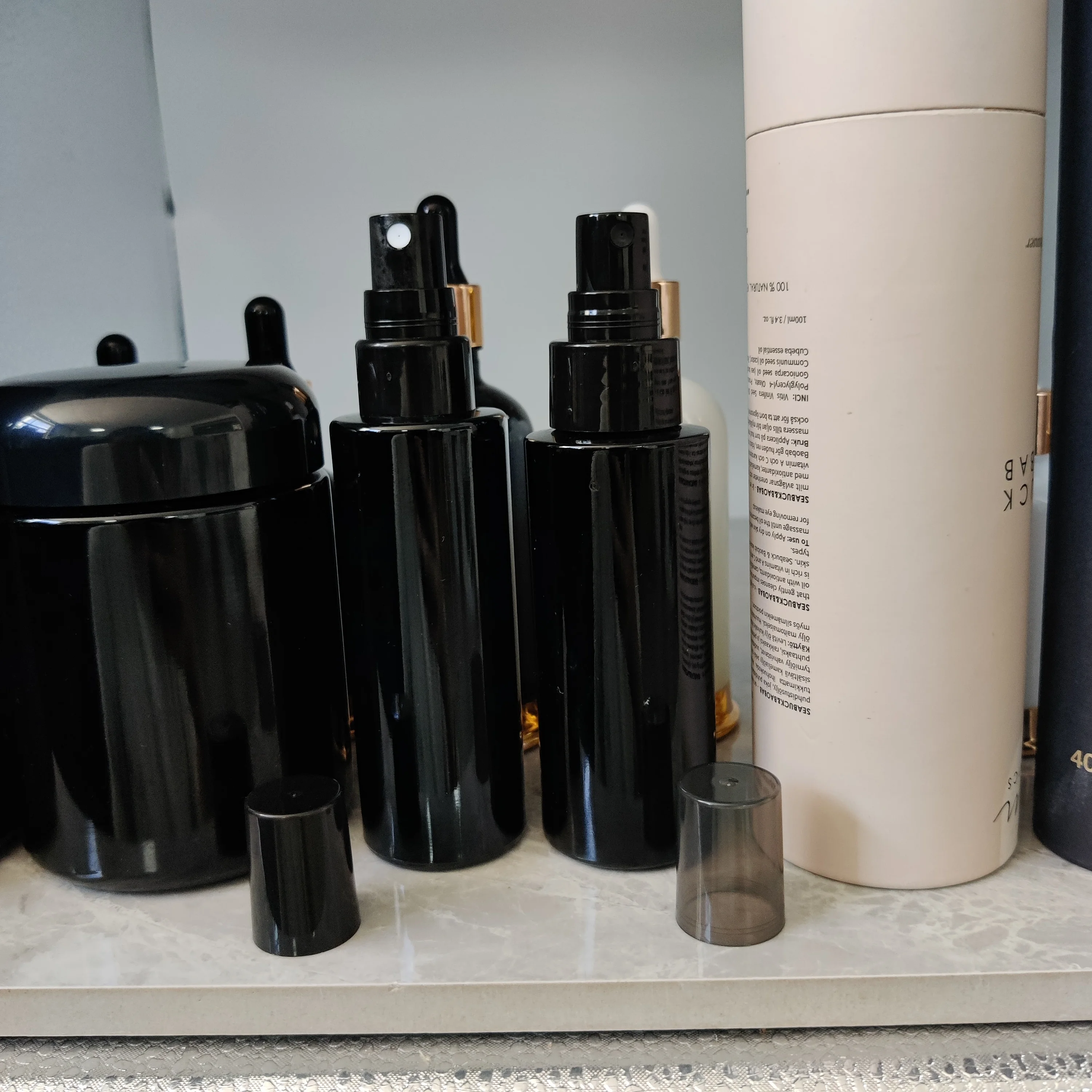 cosmetic packaging dark violet cylinder spray glass bottle