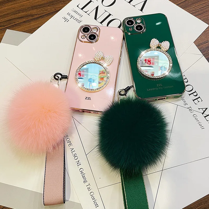 Fashion Luxury Bow Rhinestones Mirror Back Cover Plating TPU Fur Ball hand strap Girls Phone Case for iPhone 13 12 Pro Max