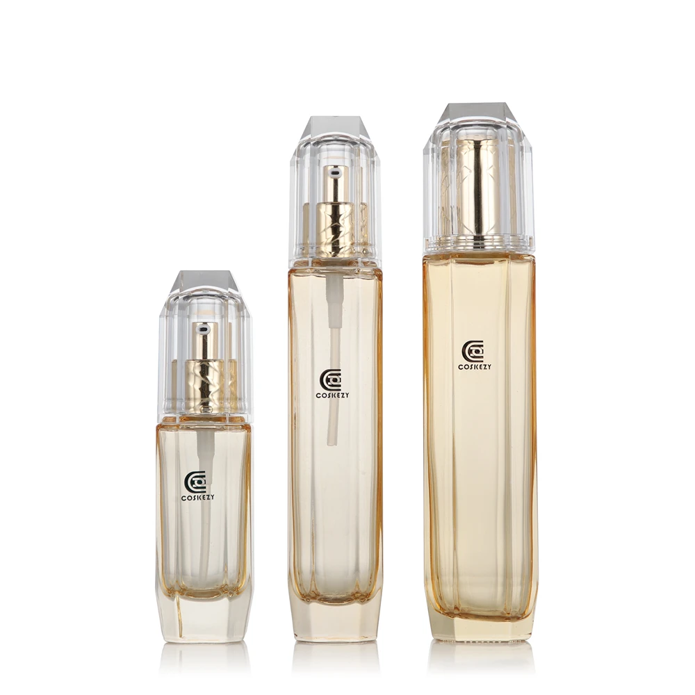Wholesale Empty Transparent Gold Glass Pump Bottle for Cosmetics 40ml 80ml 130ml with Acrylic Cap for Serum and Skin Packaging