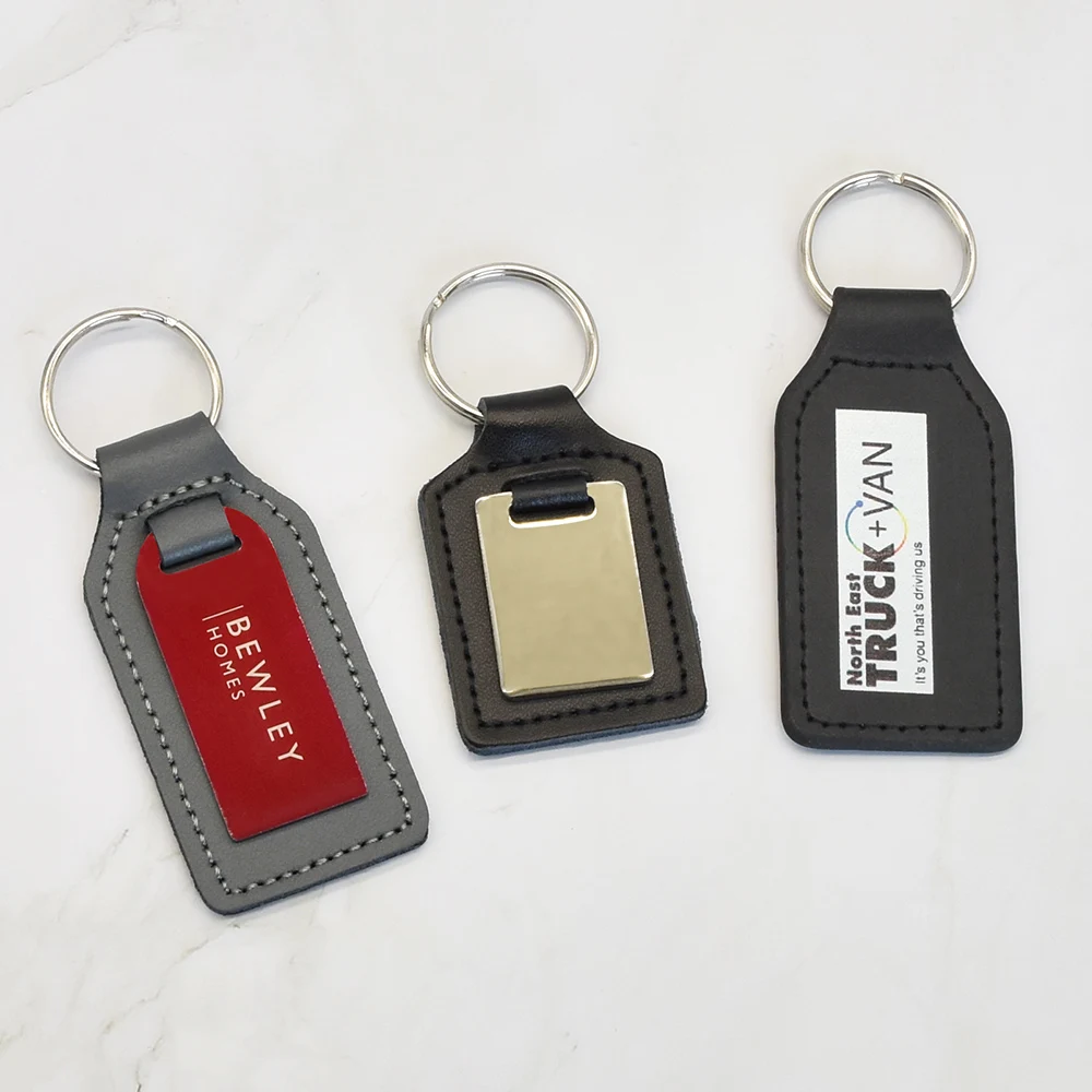 Custom embossed logo laser engraving car keychain keyring pu leather keychain metal leather keychain