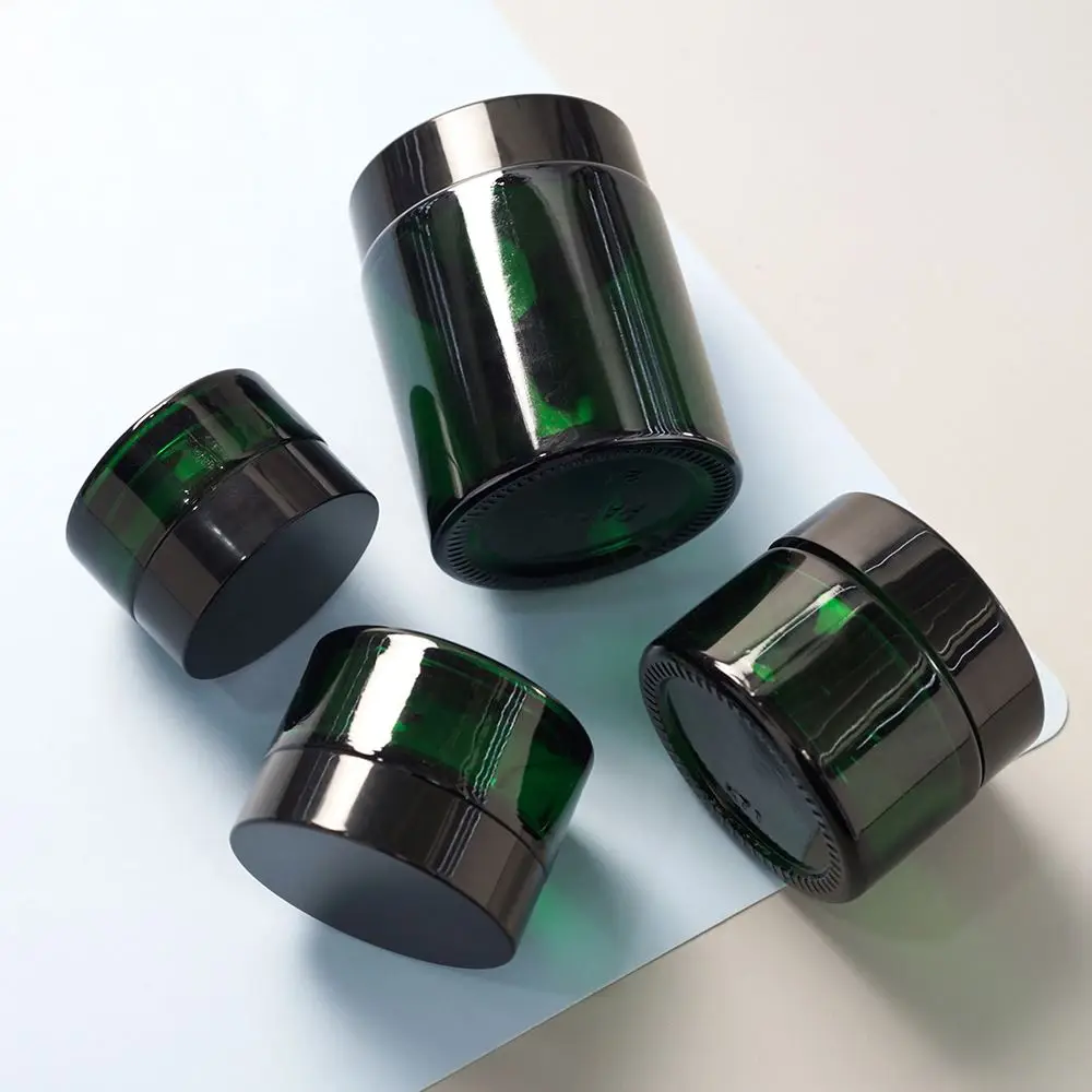 Customized or Factory Standard Low Price Wholesale Green Swivel Black Lid Face Cream/Skin Cream Cream Glass Jar