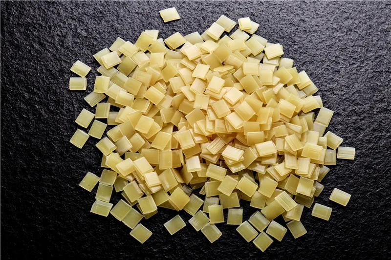 
5002 Fast Curing Adhesive Paper Box Hot Melt Adhesive Particles Yellow Flake 