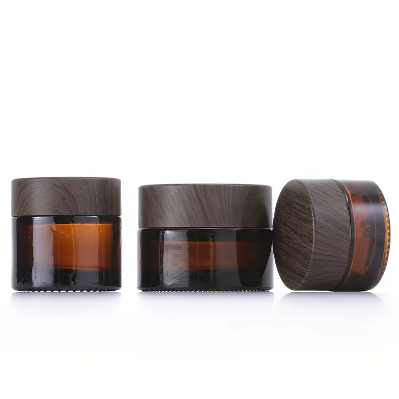 5g 10g 30g 50g 100g 4oz Custom Glass Eye Face Body Empty Cream Cosmetic Amber Jar With Black Dare Wood Lid Cheap prices