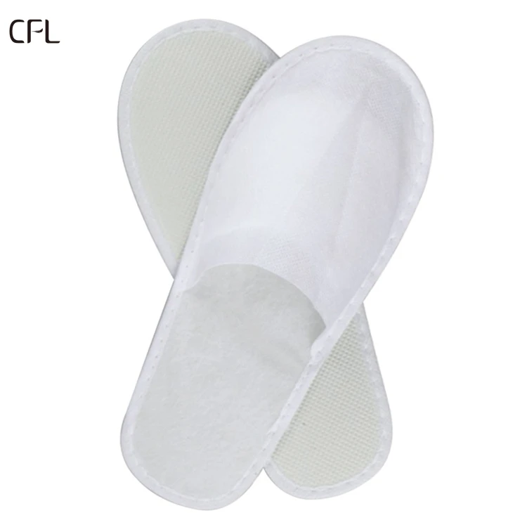 Guangzhou supplier wholesale price oem custom high quality white color disposable indoor non woven hotel slipper