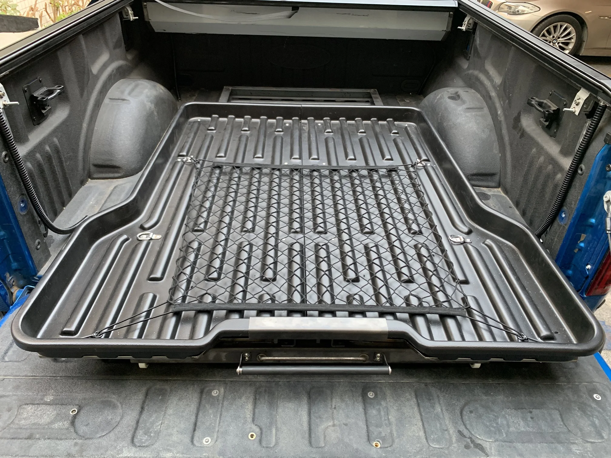 
Slide tray for truck bed liner 