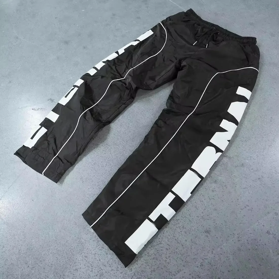 OEM Custom High Quality Sports Running Reflective Oversized Baggy Wide Leg Pants Track Pants Windbreaker  Nylon Pants For Men