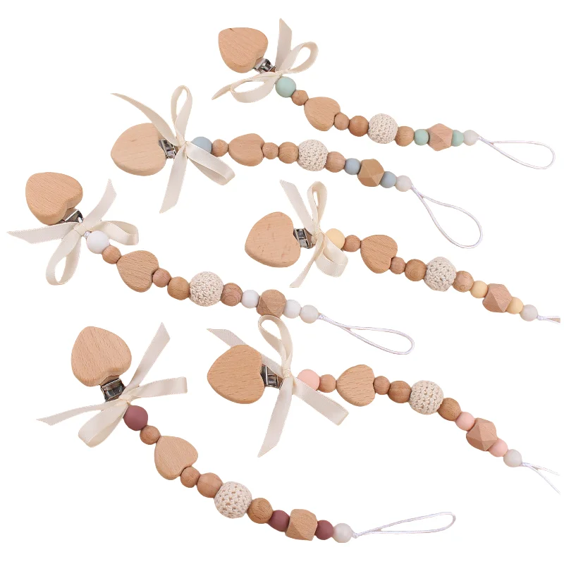 Wholesale HIgh Quality Baby Cartoon Handmade Non-slip Bow Wooden Pacifier Chain Newborn Creative DIY Baby Silicone Teething Toys