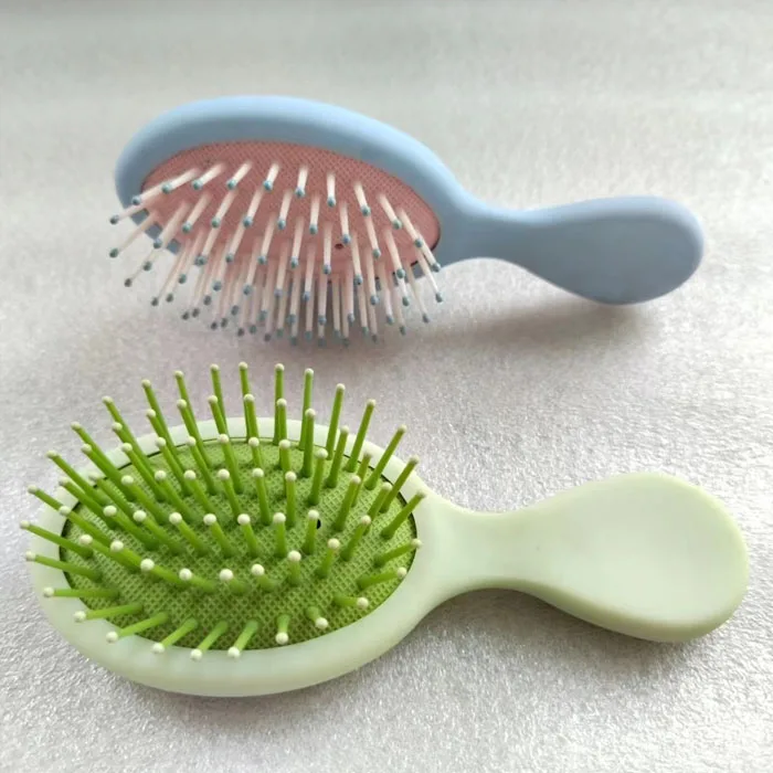 Wholesale cheap high quality massage hair brush anti static pink plastic cushion hair brush with handle