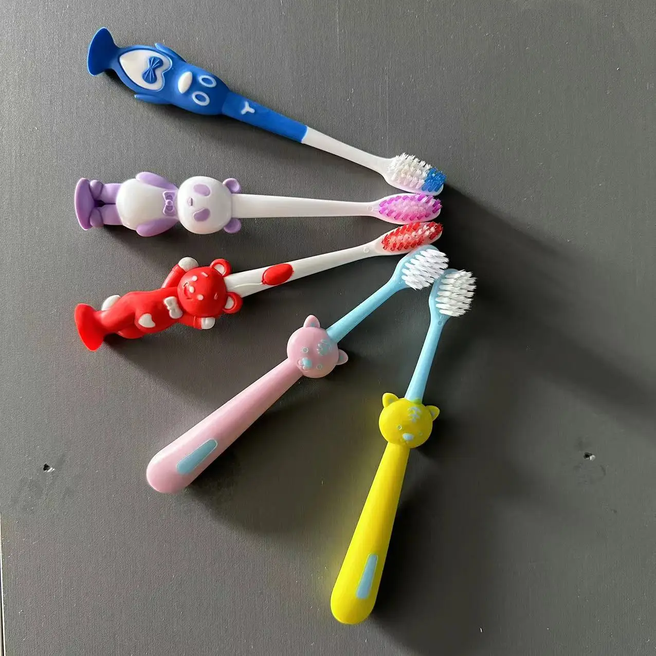 High Quality Custom Cartoon Pattern Kids Toothbrush Soft Oral Cleaning Nylon Bristle Portable with Small Cap for Home Travel