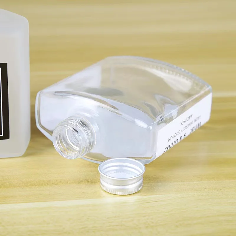 China Manufacturer Hip Flask Small Glass Bottles For Skin Care Shot Glass Bottle Body Cream Square Bottle for Shower Cream