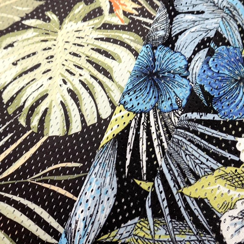 Breathable 100% polyester wrap knit custom leaf printed 130GSM eyelet sports mesh fabric for basketball tshirt