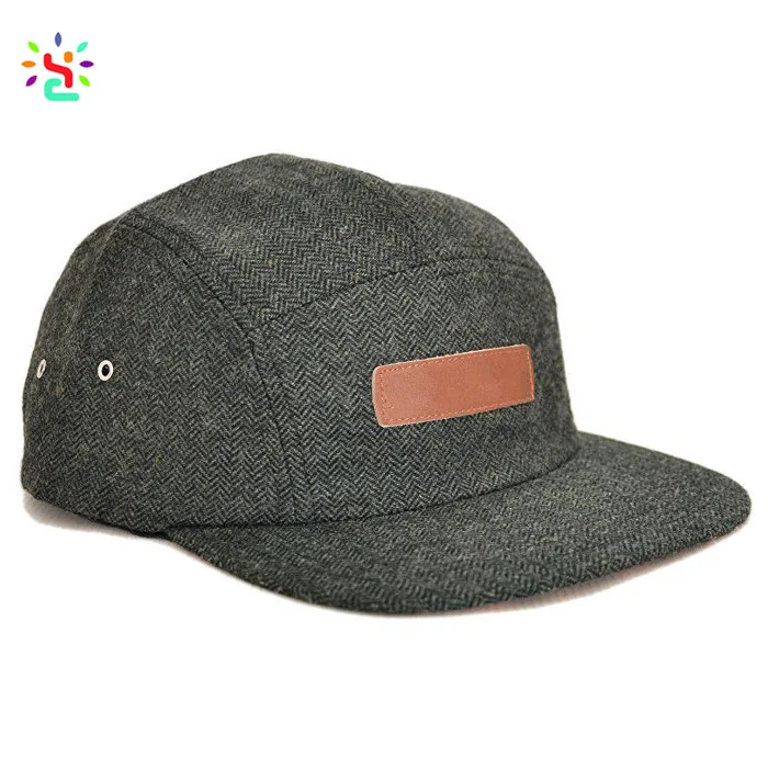 Shenzhen New Apparel custom 5 panel leather strap cap trucker hats with authentic metal ventilation eyelet