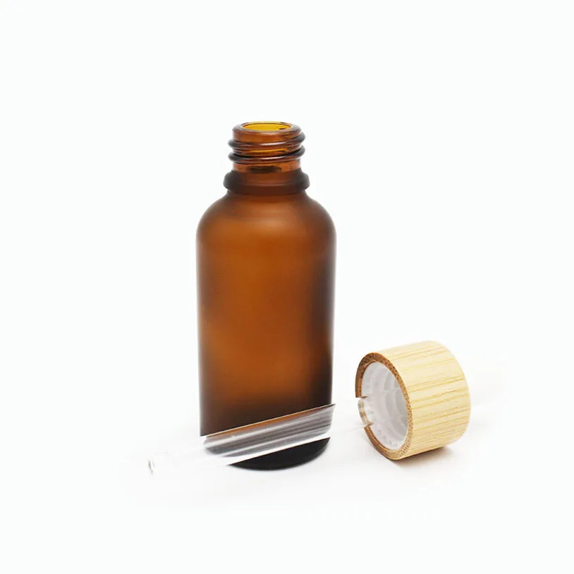 Liquid foundation serum custom 30ml frosted amber glass eye drop bottle with wooden looks cap dropper pipette on sale