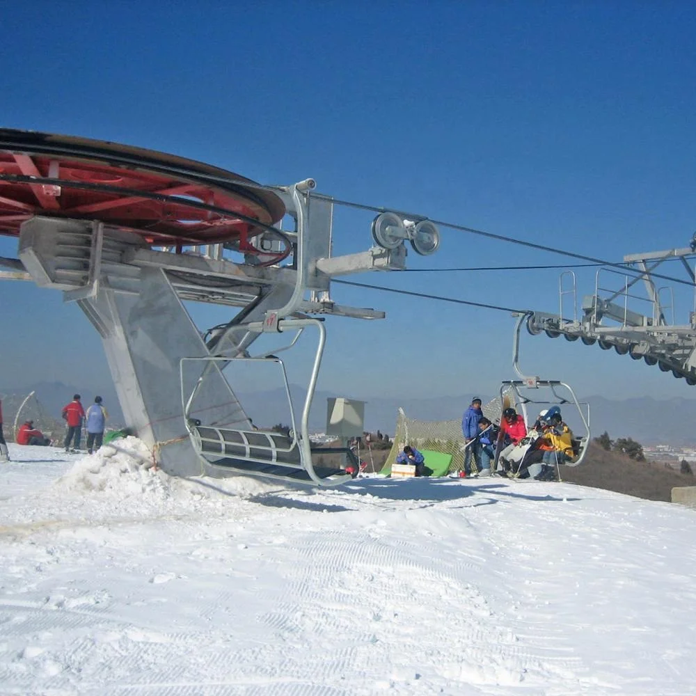 Ropeway chairlift with  four seats for four persons one chair  in ski resort ski area