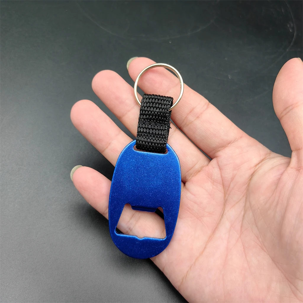 Hot promotional cheap manual metal blank aluminum alloy woven ribbon strap oval custom beer can wine bottle opener with keychain