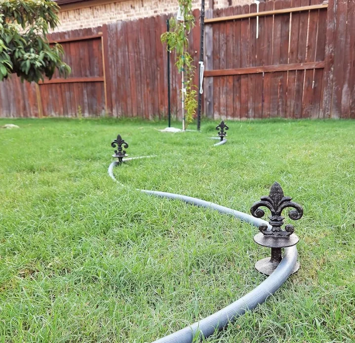 Antique Black Cast Iron Garden Strong and Decorative Hose Guide that Protects Your Plants and Provides Elegance to Your Garden