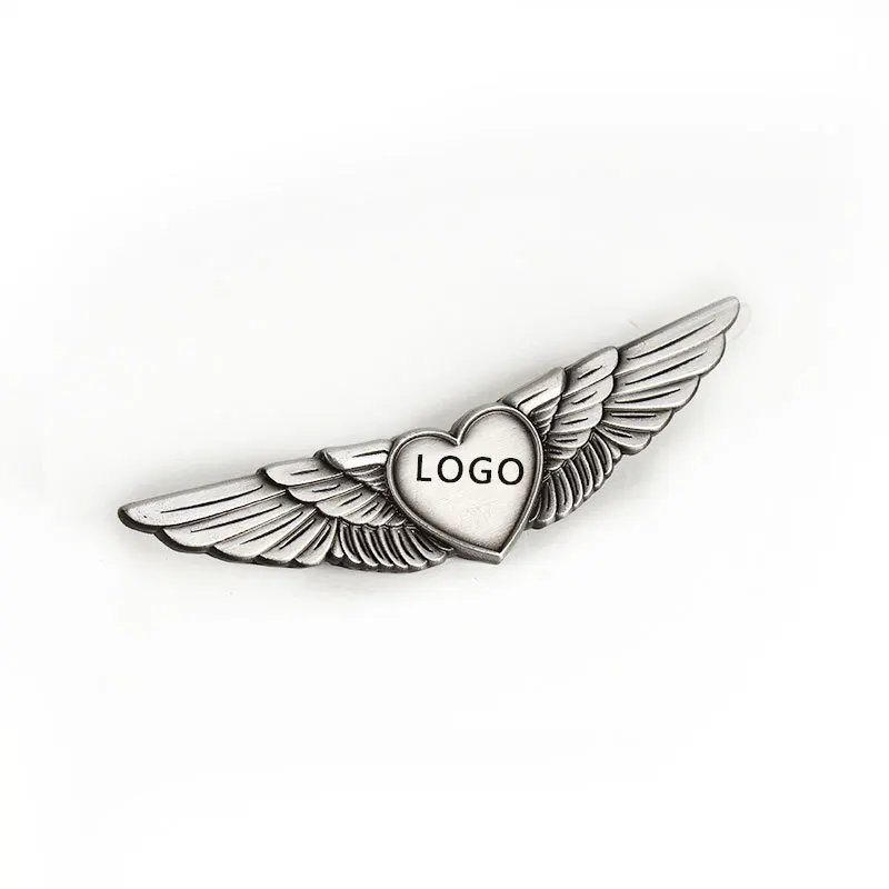 Heart shape logo metal zinc alloy embossed 3d gold plated pilot wings shape aviation airline badges for souvenir