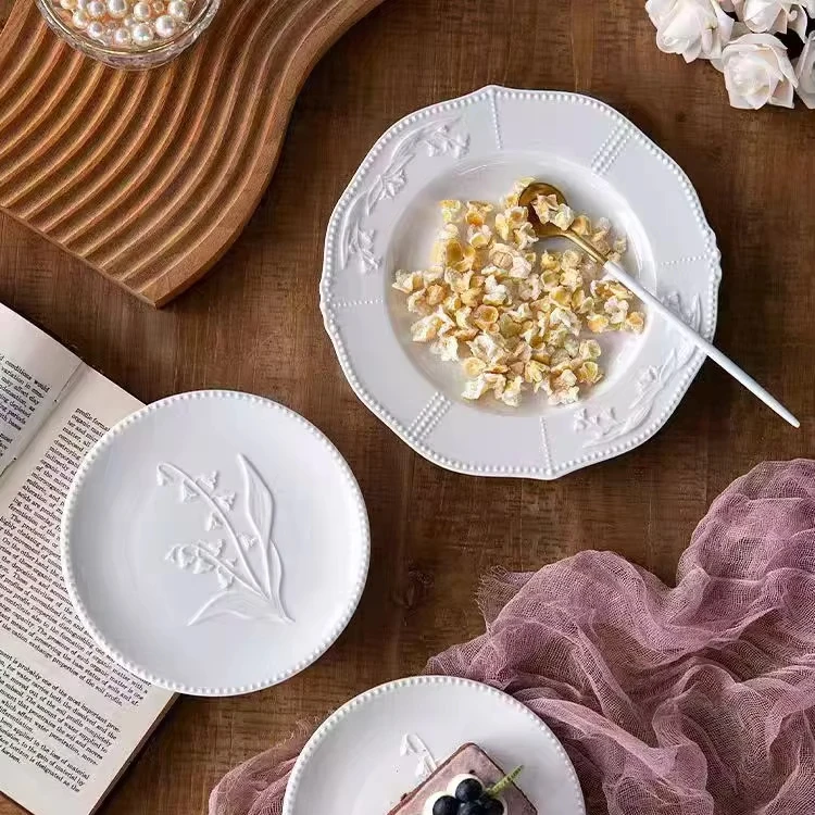 Wholesale Irregular Retro Handmade Glazed Three Dimensional Relief Bell Orchid Nordic Matte White Dessert Ceramic Dinner Plates