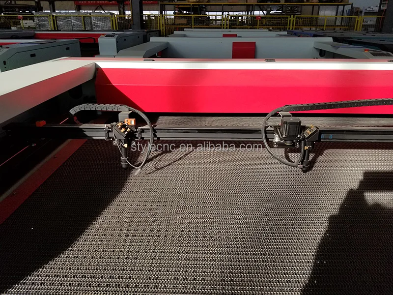Industrial Laser Fabric Cutting Machine with large conveyor table and automatic feeding system