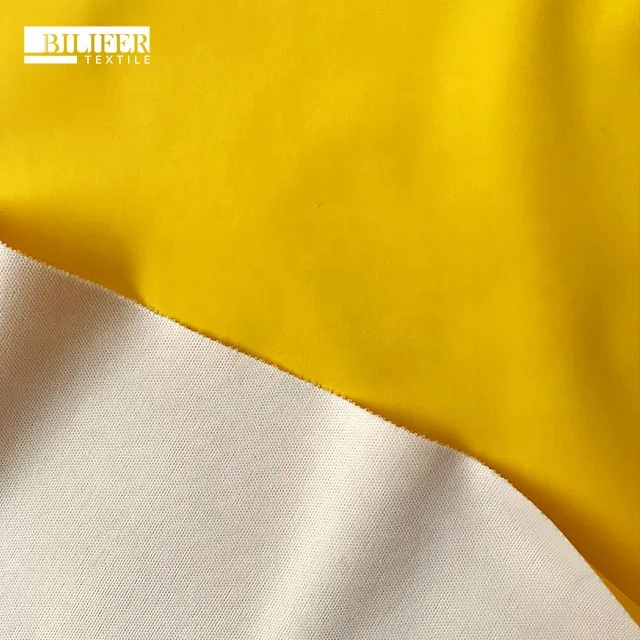 wholesale faux leather fabric 4 way stretch waterproof leather raincoats fabric