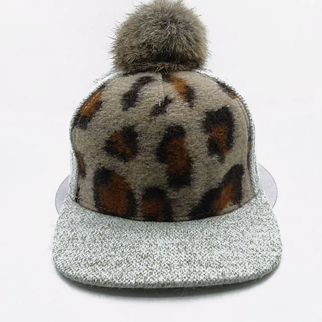 Gray autumn and winter ladies hats with a small fur ball on top