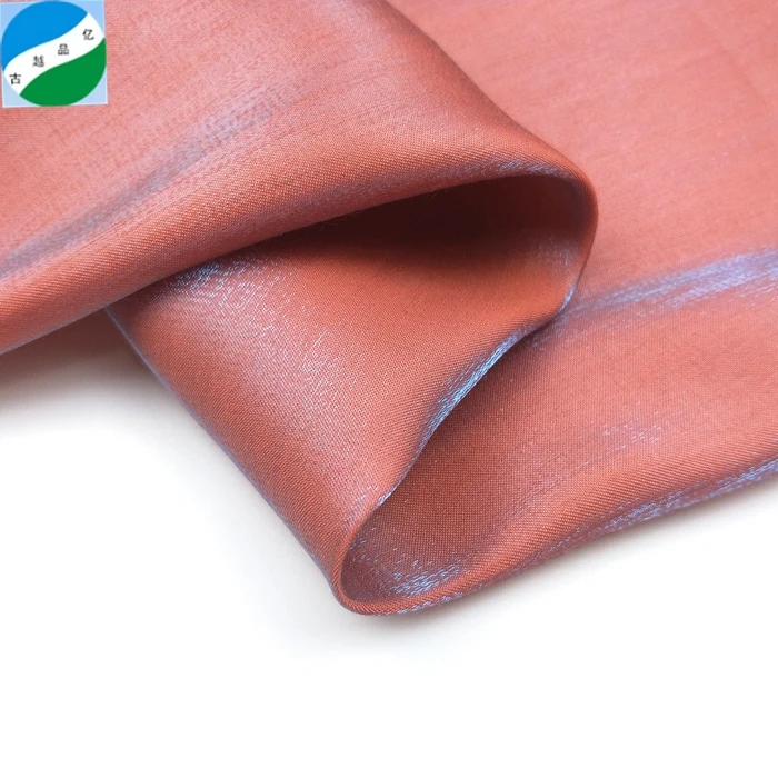 High quality  100% woven rayon and polyester shiny  ready good fabric stock lot for garment