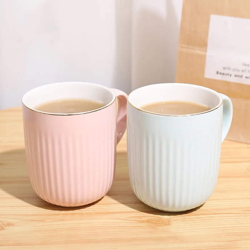 Creative striped restaurant with pink cutlery and porcelain teacups with handles