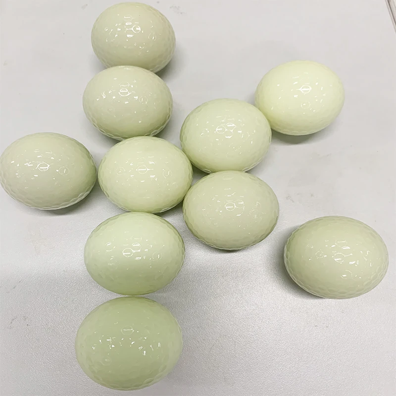white fluorescent golf ball in golf  balls