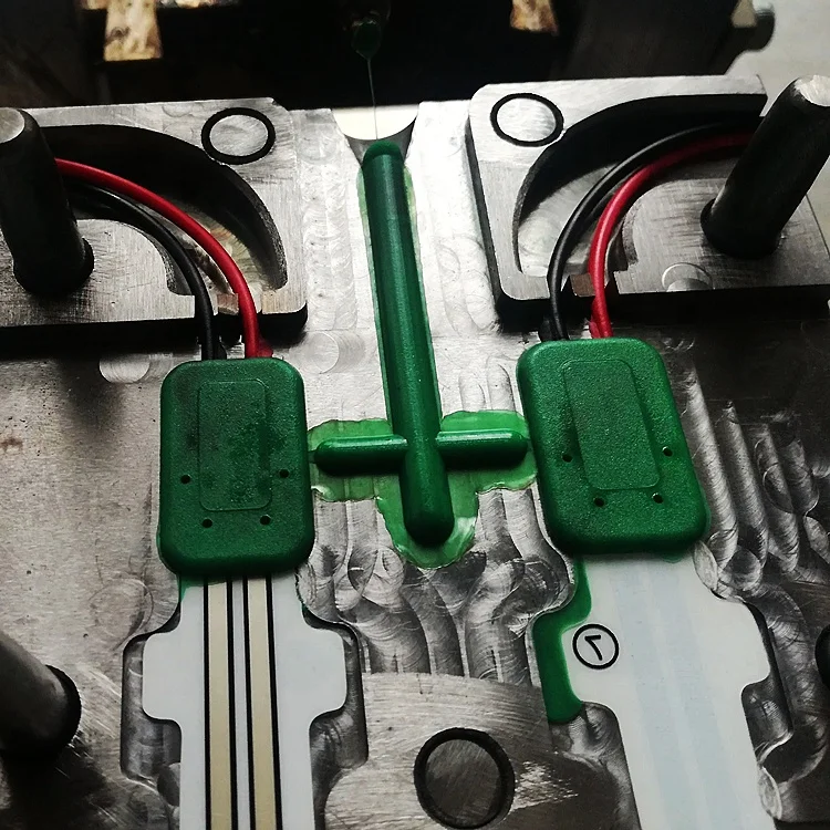 Low voltage injection molding service for electronic devices