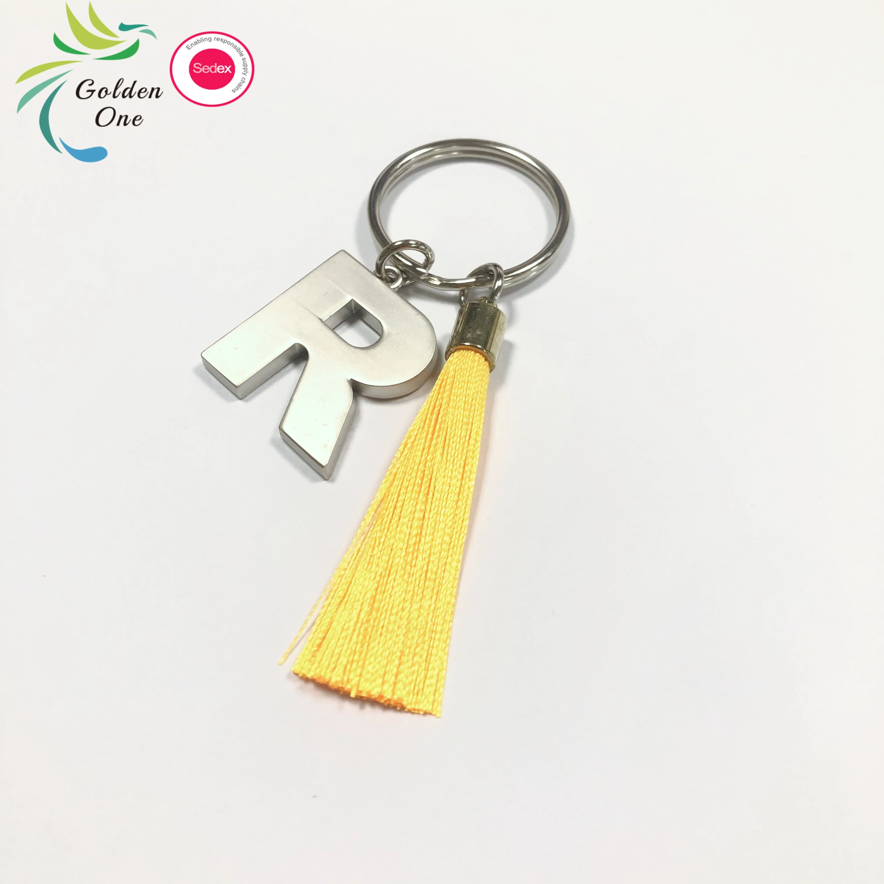 new design manufacturer colored fringe gift key chain 26 letters printing logo fashion metal keychain for bags