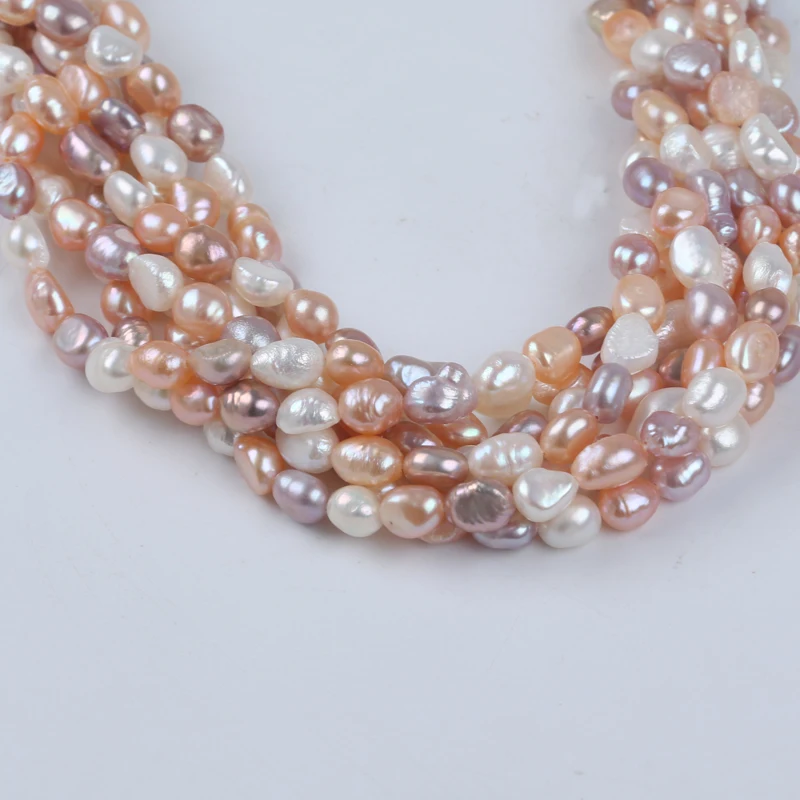 Zhuji 6-7mm White Pink Purple Natural Freshwater Baroque Shape Pearl Stand For Sale