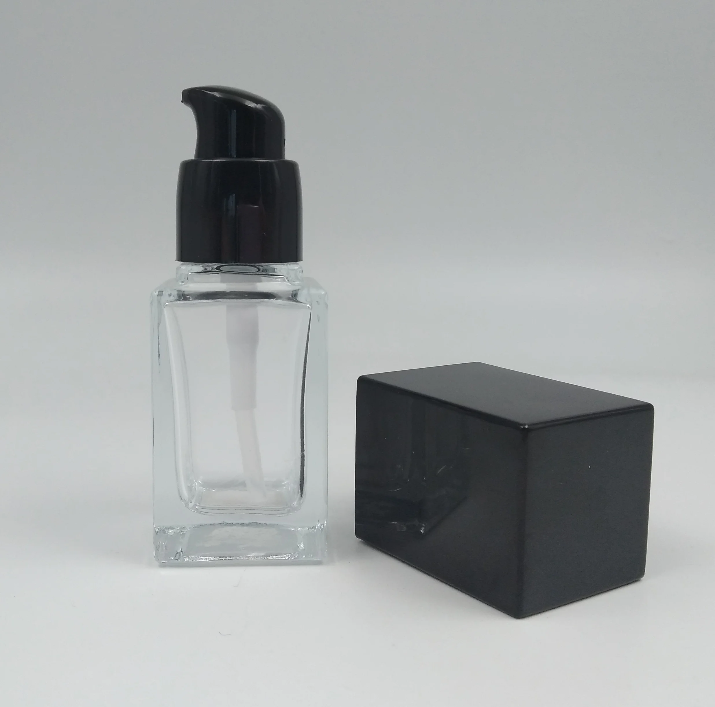 Wholesale new product Clear rectangle bird black pump 30ml 1 oz skin care lotion glass bottle