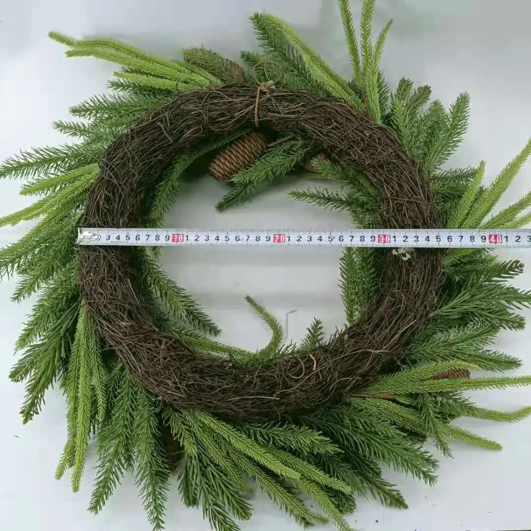 Artificial pine needles and pinecone wreath for Christmas