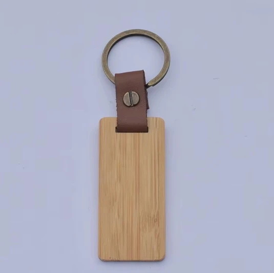 Factory direct selling 100% natural organic cute carving bamboo keychain plus logo key ring tags