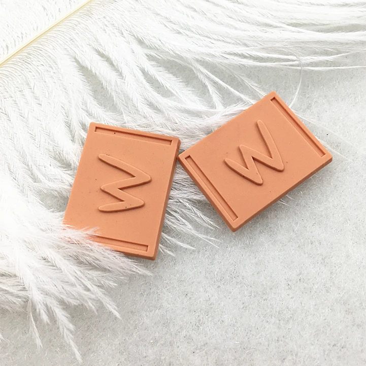 Textured 2D/3D Embossed Garment Rubber Patches High Quality Custom Private Logo Sew On PVC Rubber Labels For Clothing