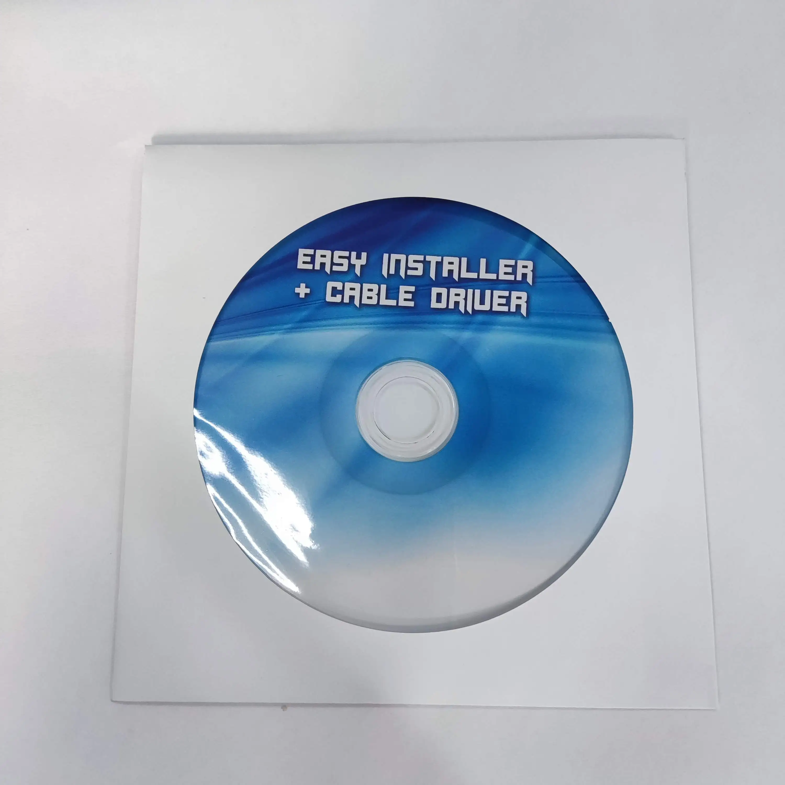 
 Услуги по упаковке белых бумажных пакетов (рукавов, кошельков) с драйвером cd дисков и дублированием печати 100 г/кв. М  