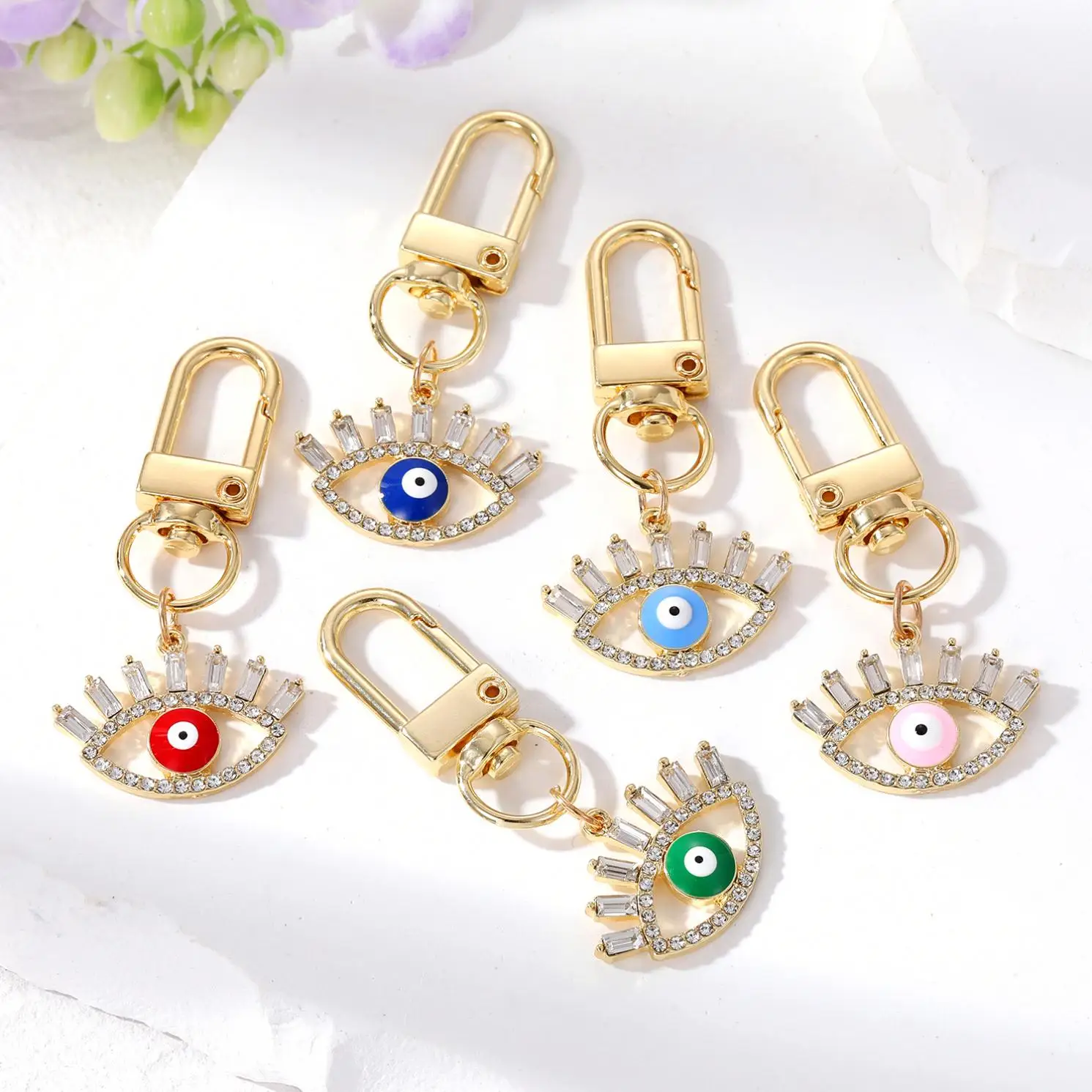 Cross-border e-commerce ornament hollow diamond eyelash eye keychain alloy geometric oil dripping Devil eye ornaments