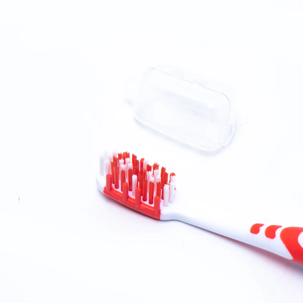 Made in China adult toothbrush with pp colorful handle gum massage feature silicone adult toothbrush