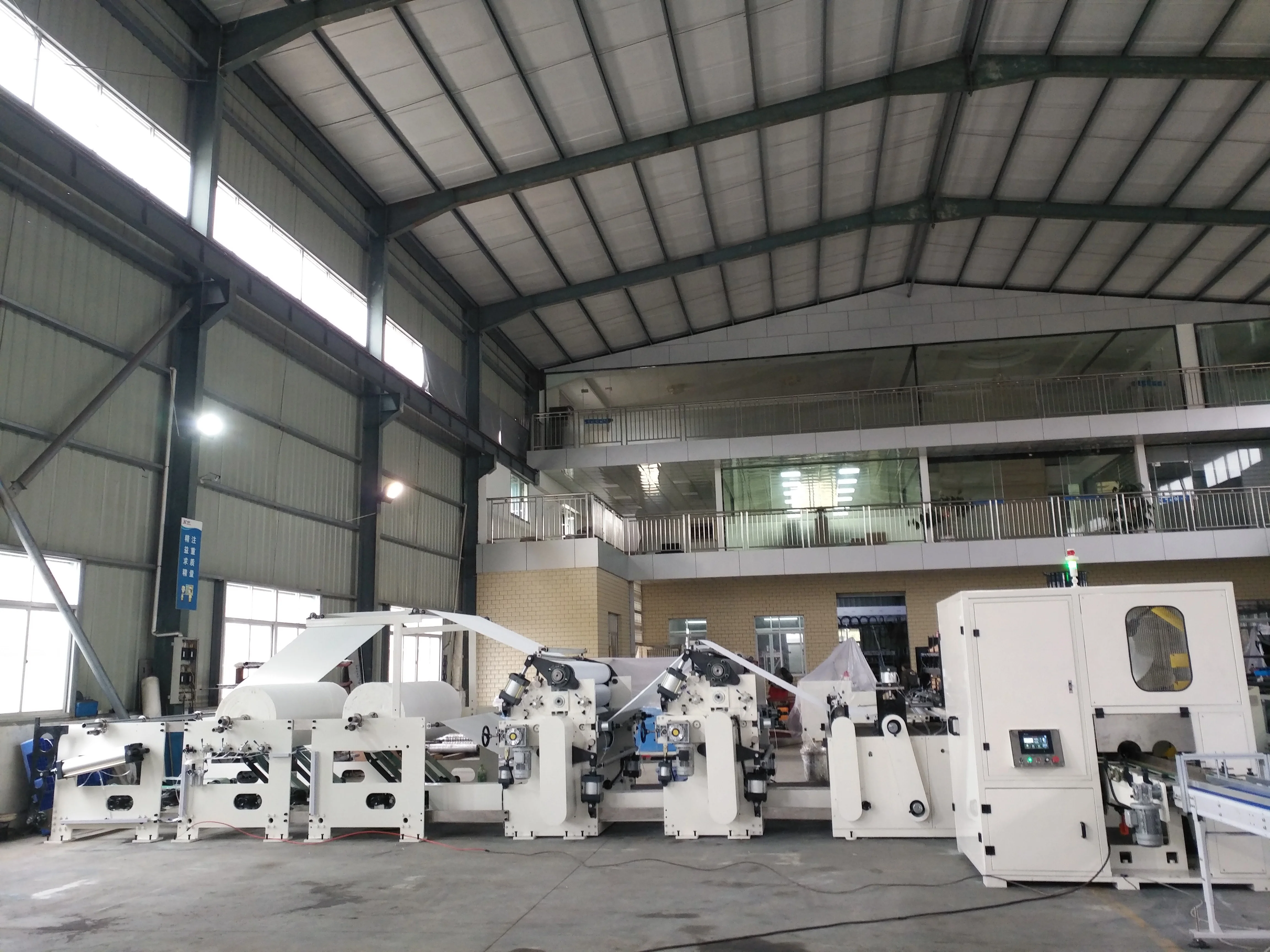 China manufacturer color glue lamination kitchen towel production line color printing double embossing cutting packing machine