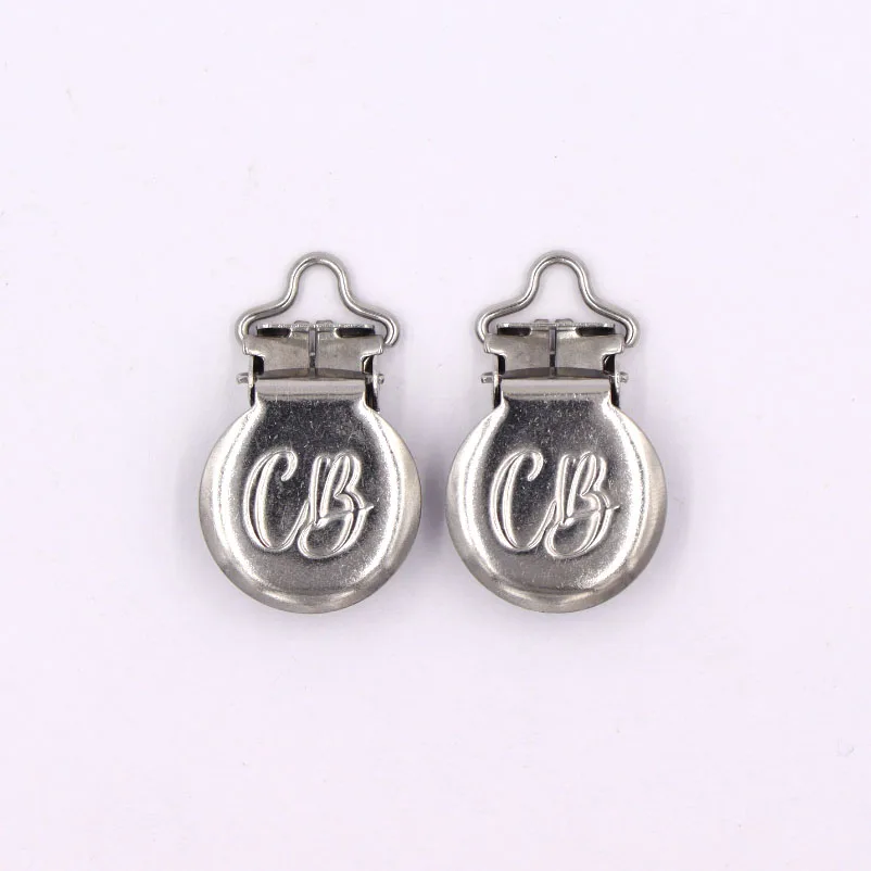 Factory custom design stainless steel baby pacifier clips for ribbon