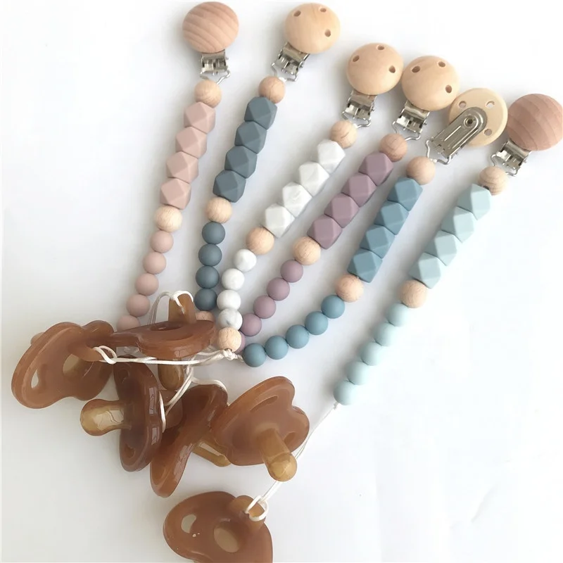 
Custom New Launch Silicone Pacifier Holder Pacifier Wooden Clip for Baby AMAZON Silicone Teething Beads Teether Toys 