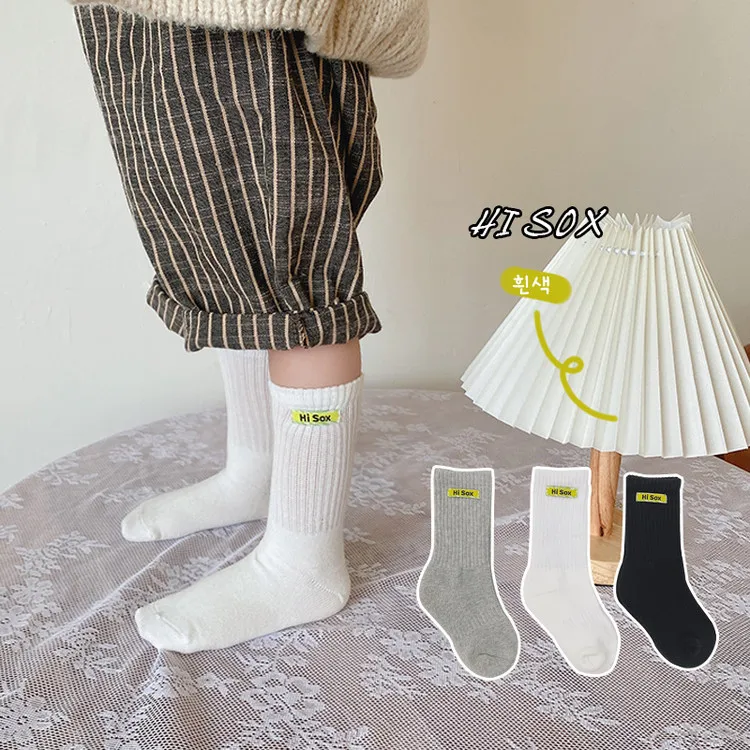 Hot selling cotton children long socks custom logo fashion comfortable school black white grey kids with phrases terry socks