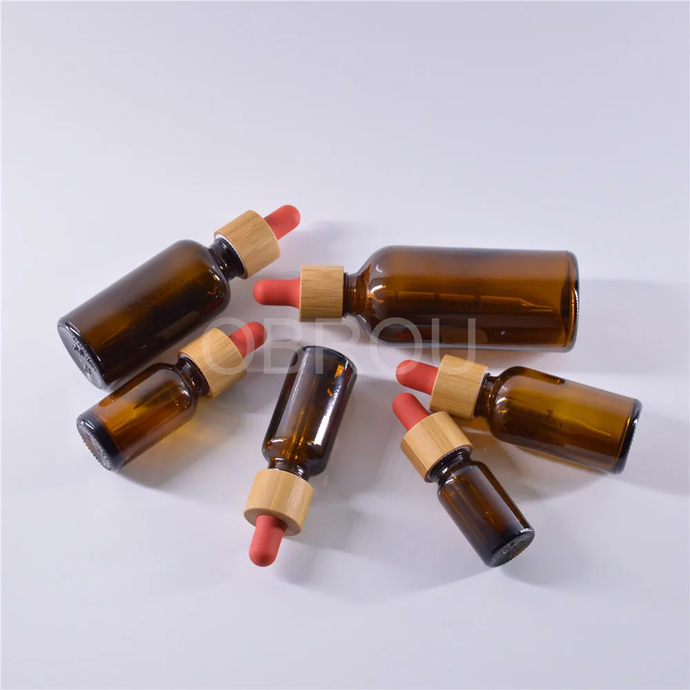 Wholesale wooden dropper cap type amber glass dropper bottles 5ml 10 ml 15ml 20ml 30ml 50ml 100 ml perfume oil bottle