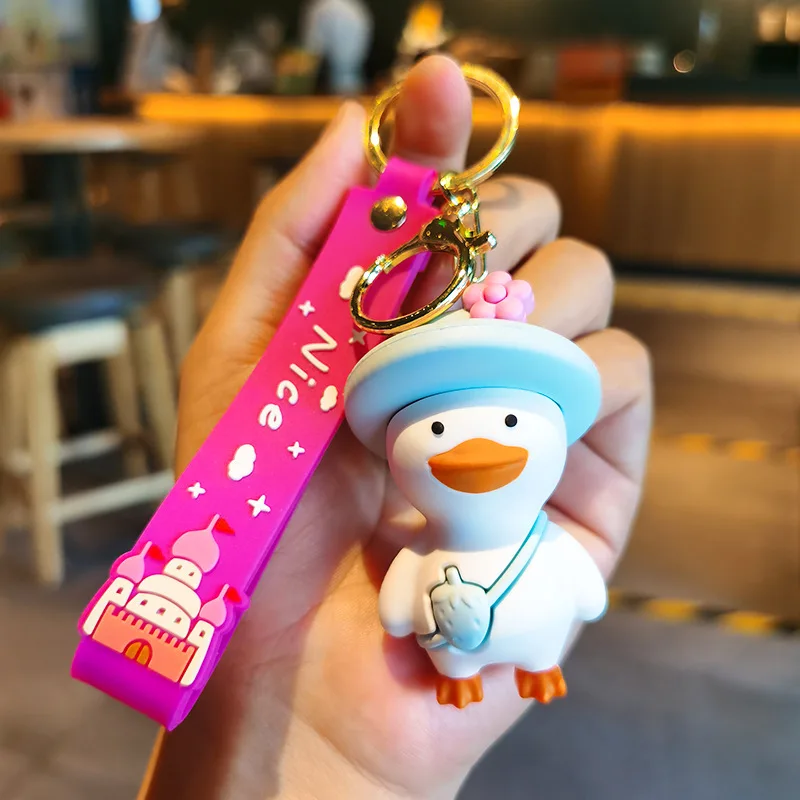 Wholesale cartoon cute funny duck soft rubber pvc keychain girl schoolbag pendant crystal key chains