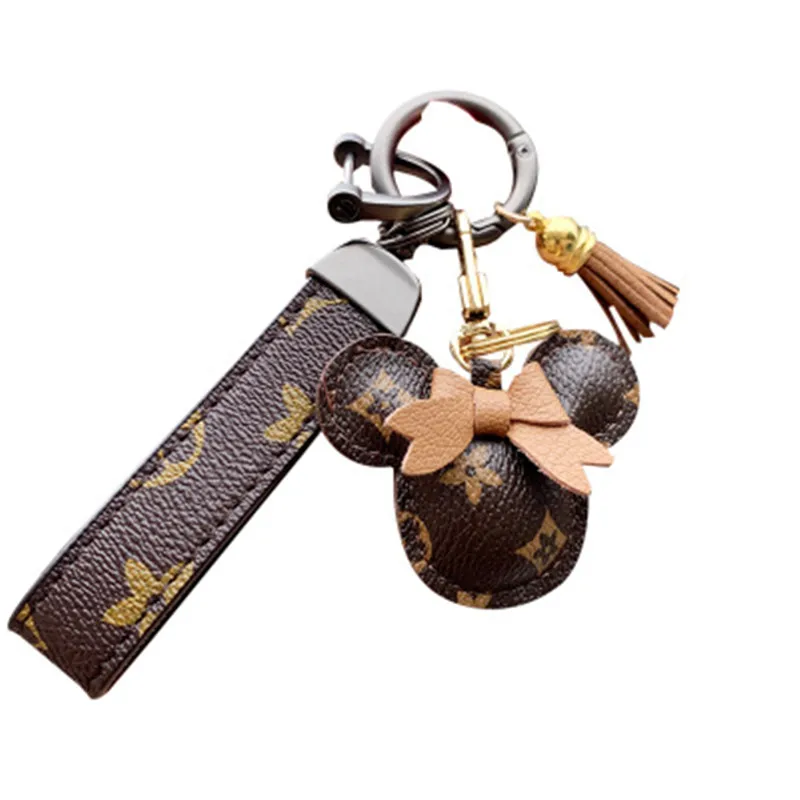 
Cute Bowknot Leather Tassel Pom Pom Ball Key Pendant Creative Car Purse Charm Key Chain Couple Ladies Bag Ornament 